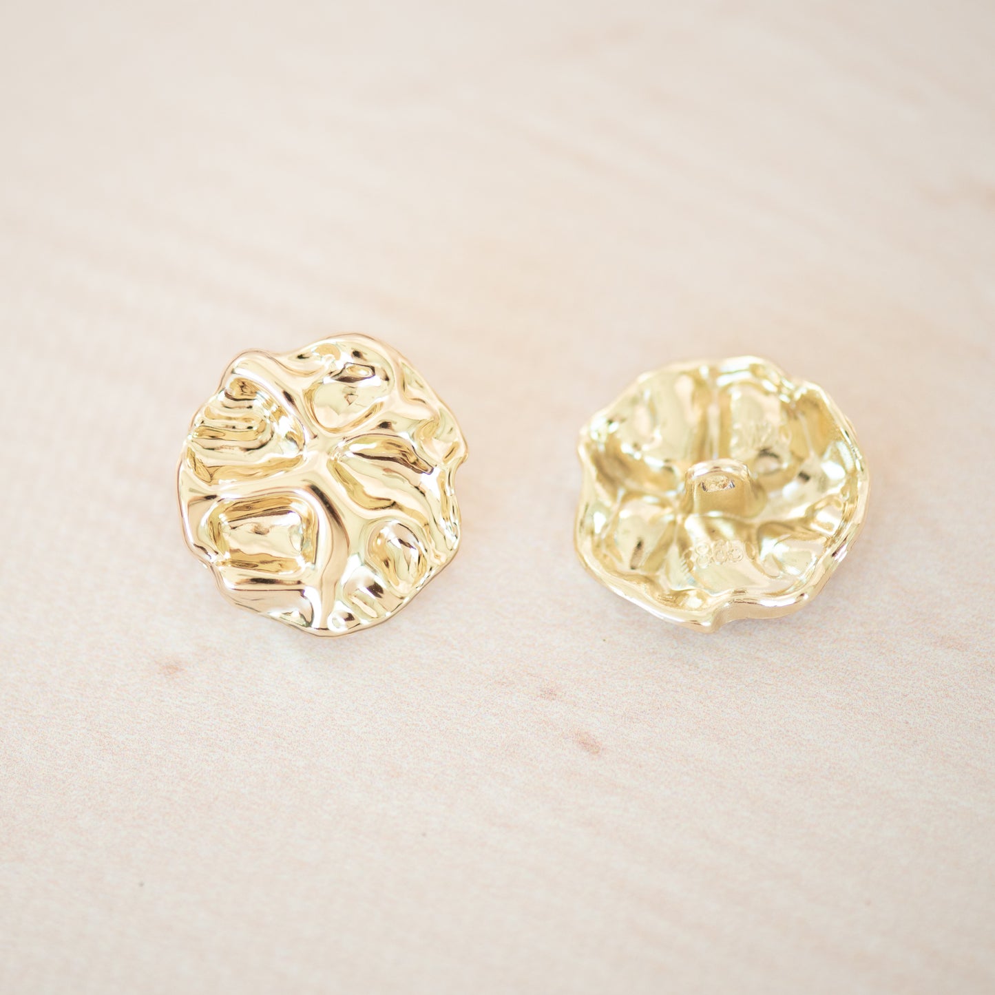 Gold asymetric metal button