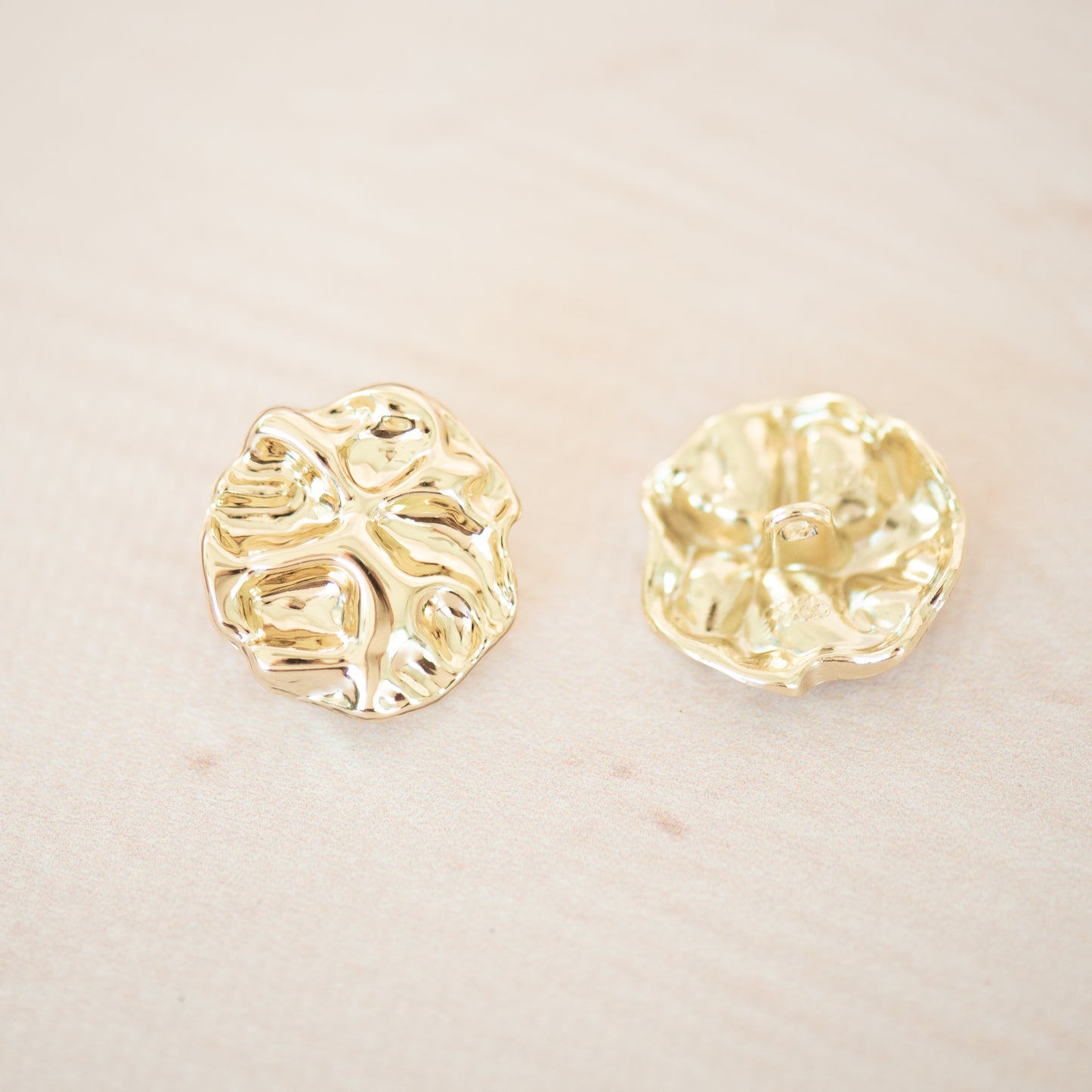 Gold asymetric metal button