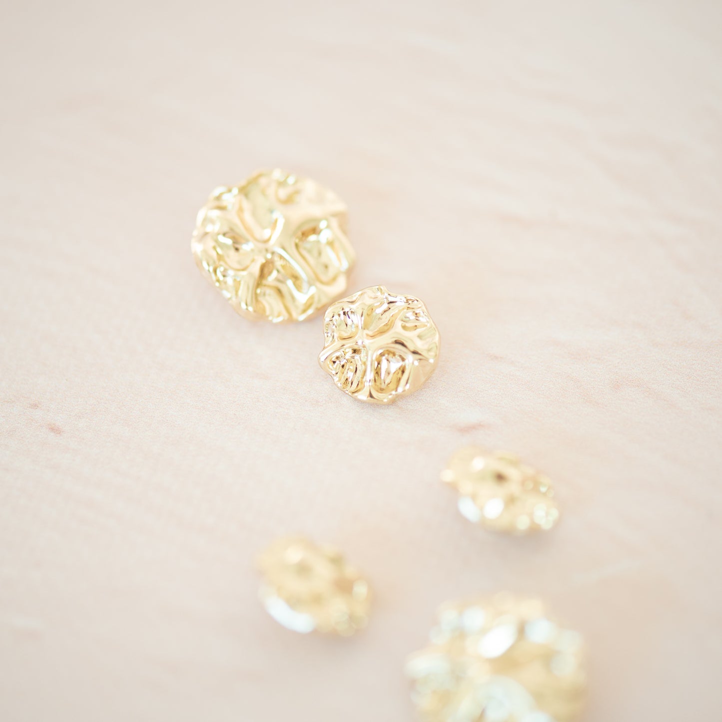 Gold asymetric metal button