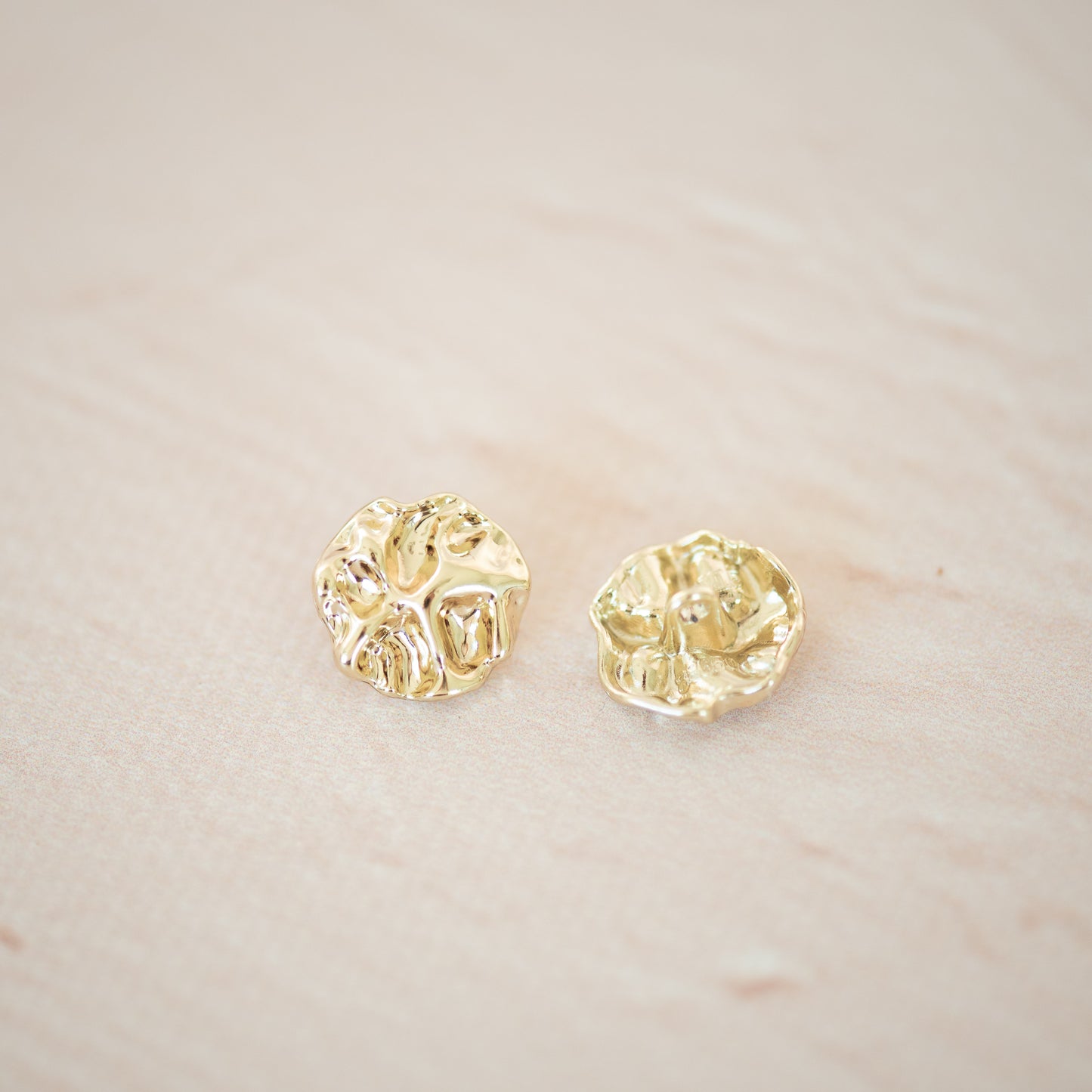 Gold asymetric metal button