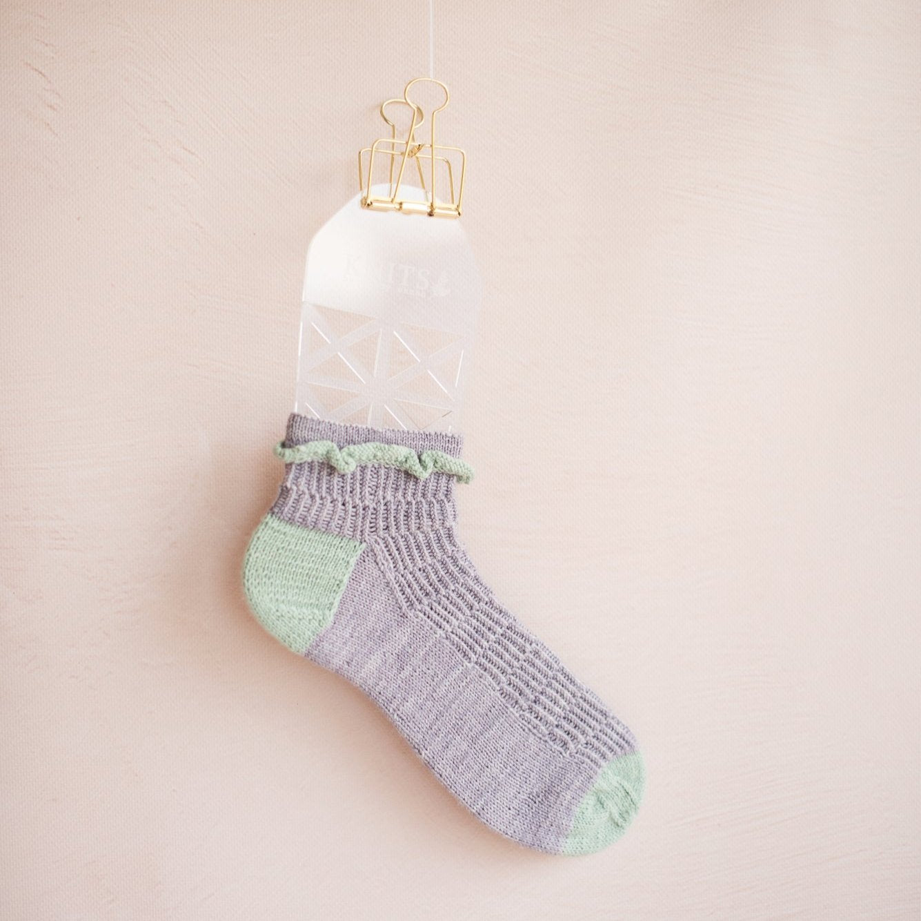 Sock blocker aid for knitting socks