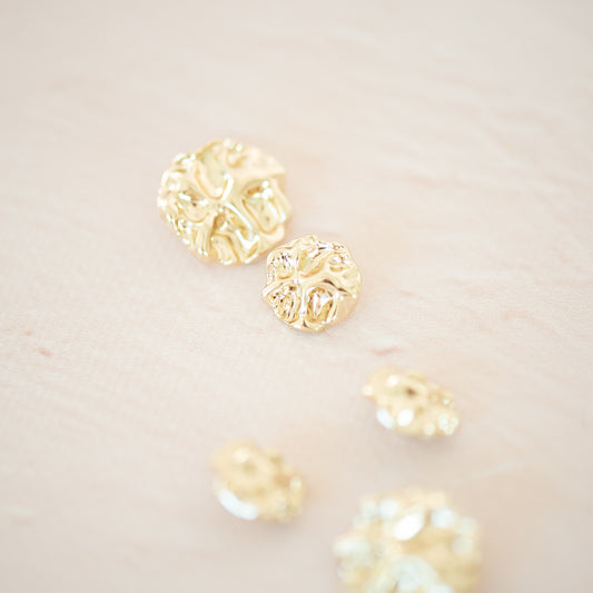 Gold asymetric metal button