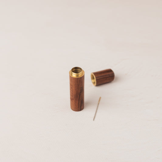 Needle storage tube in wood