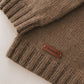 Olive green knitted fabric with a 'Handmade' label on a light background