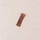 Brown tag with text "made by mom"