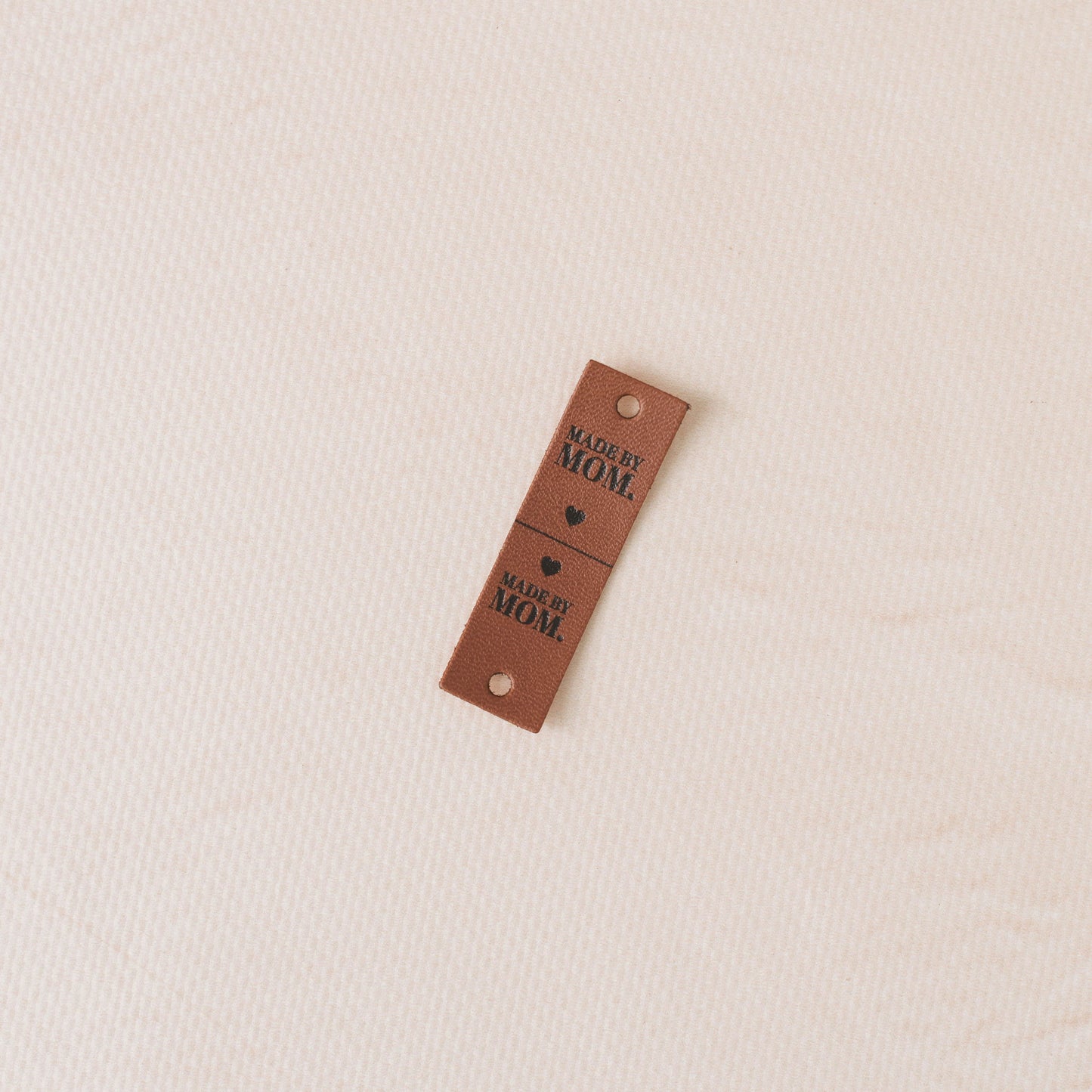 Brown tag with text "made by mom"