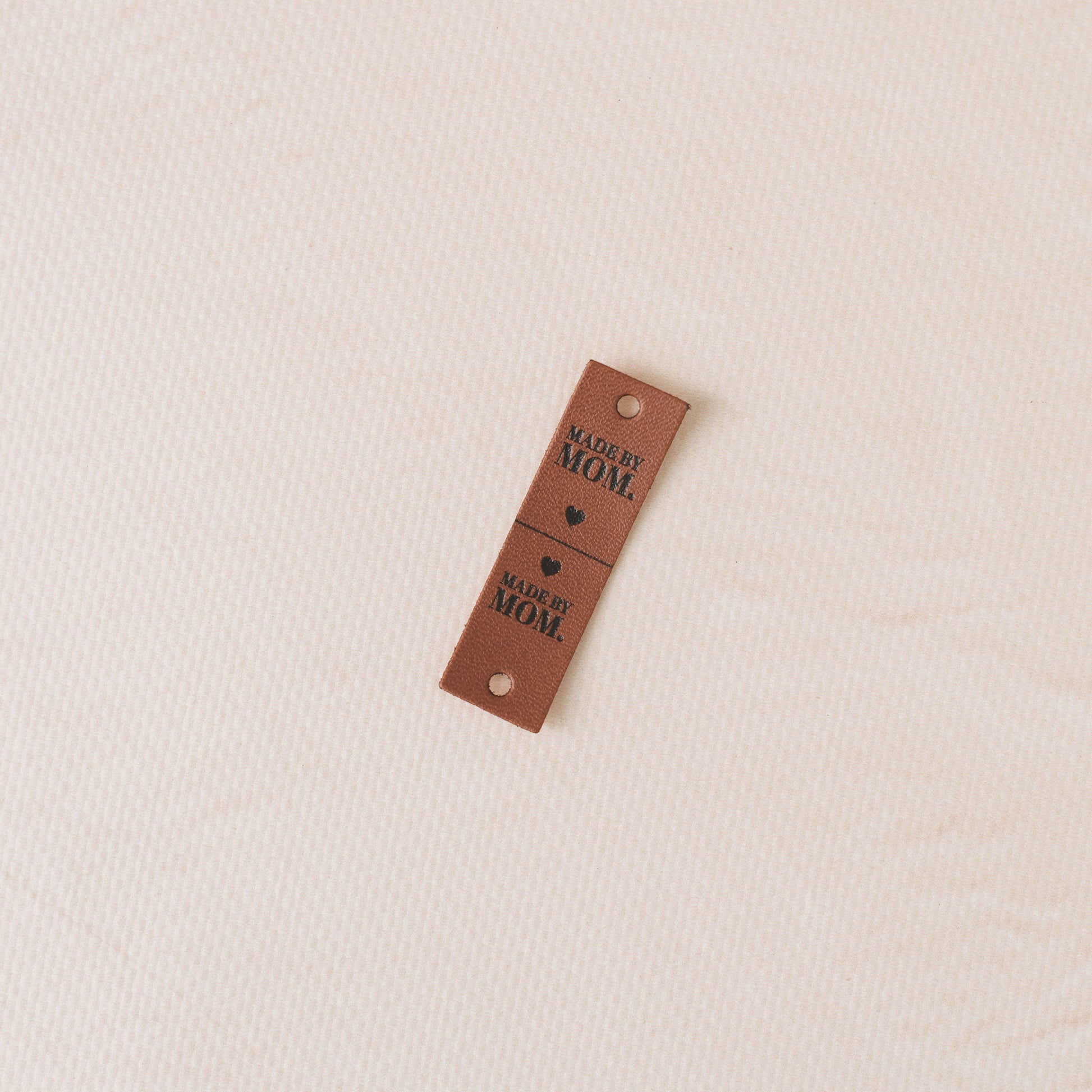 Brown tag with text "made by mom"