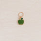 apple charm with ring, used in knitting.